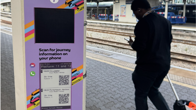 Journey Alerts travel assistance podium with QR code to access personalised public transport information
