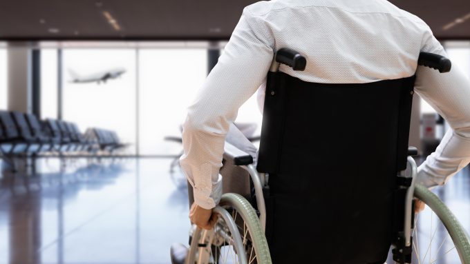 Disabled Adult People Travel In Wheelchair At Airport